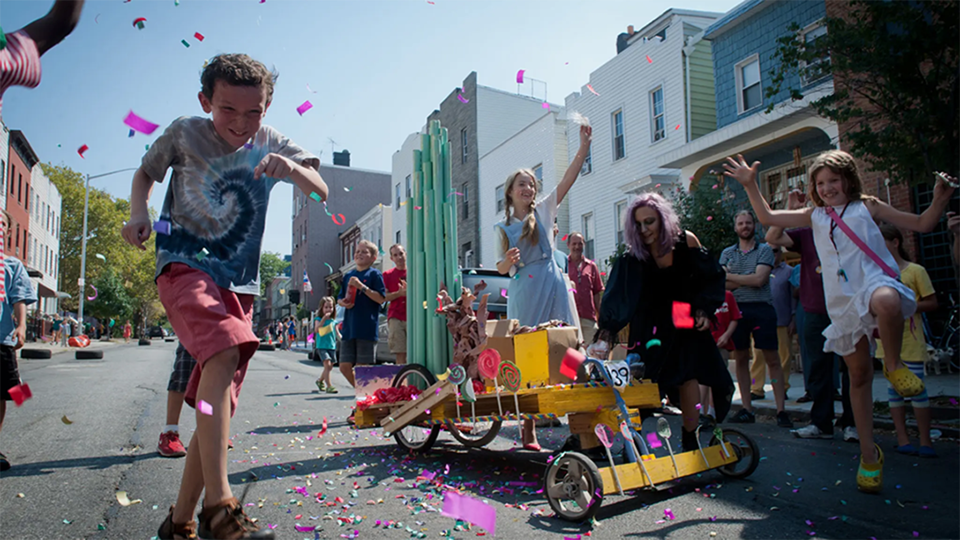 Confetti flies as the final (candy themed) car crosses the finish line at the South Slope Derby.